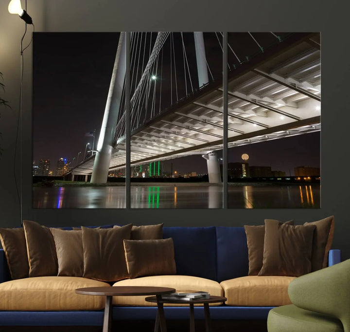 A modern living room showcases the "Dallas City Lights" night skyline cityscape as a triptych on museum-quality canvas. Enjoy the art's longevity with its UV-protective coating, all available with free shipping.