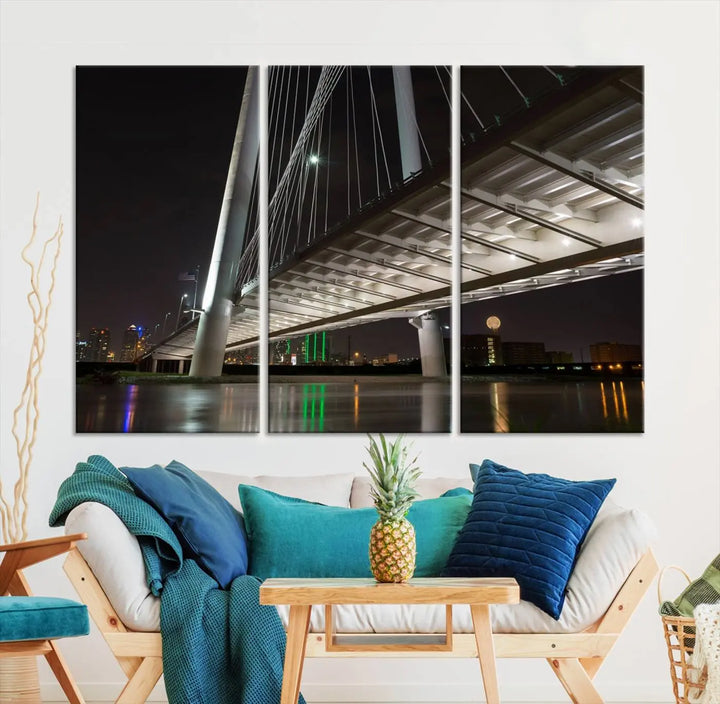 A modern living room showcases the "Dallas City Lights" night skyline cityscape as a triptych on museum-quality canvas. Enjoy the art's longevity with its UV-protective coating, all available with free shipping.