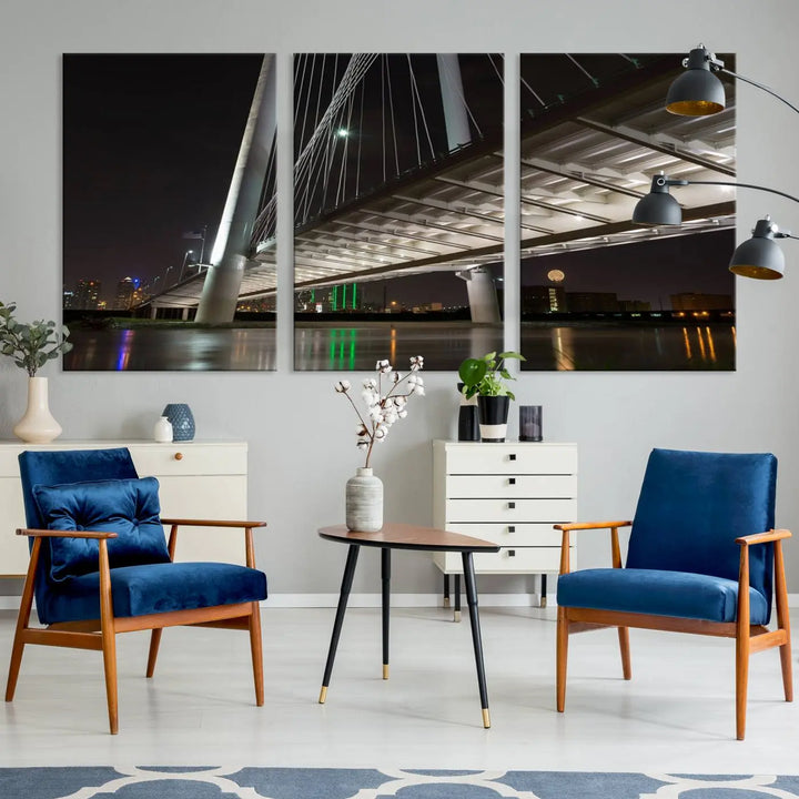 A modern living room showcases the "Dallas City Lights" night skyline cityscape as a triptych on museum-quality canvas. Enjoy the art's longevity with its UV-protective coating, all available with free shipping.