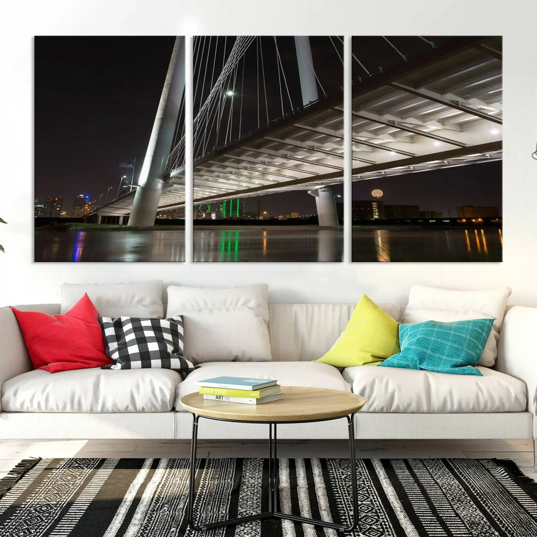 A modern living room showcases the "Dallas City Lights" night skyline cityscape as a triptych on museum-quality canvas. Enjoy the art's longevity with its UV-protective coating, all available with free shipping.