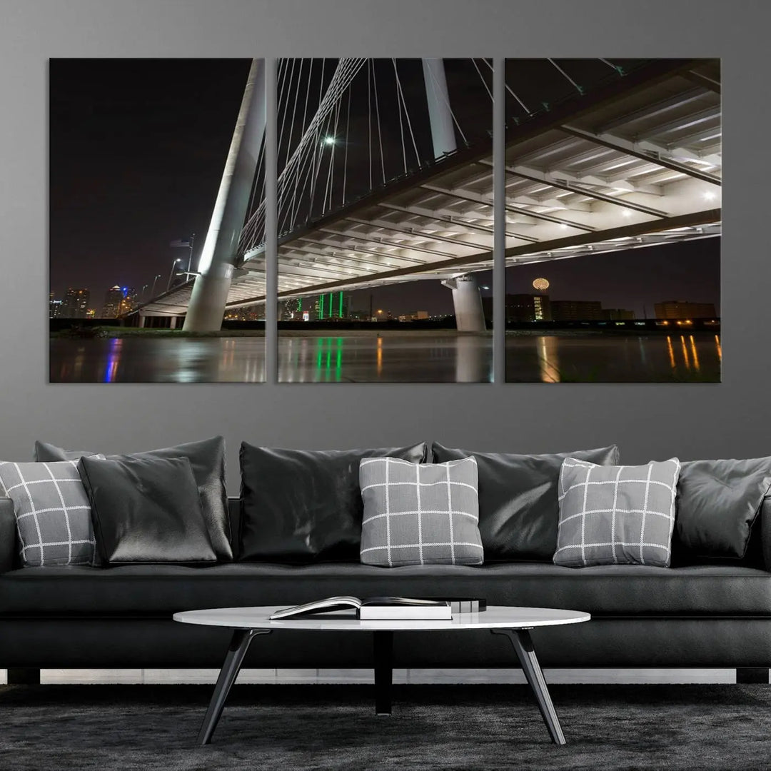 A modern living room showcases the "Dallas City Lights" night skyline cityscape as a triptych on museum-quality canvas. Enjoy the art's longevity with its UV-protective coating, all available with free shipping.