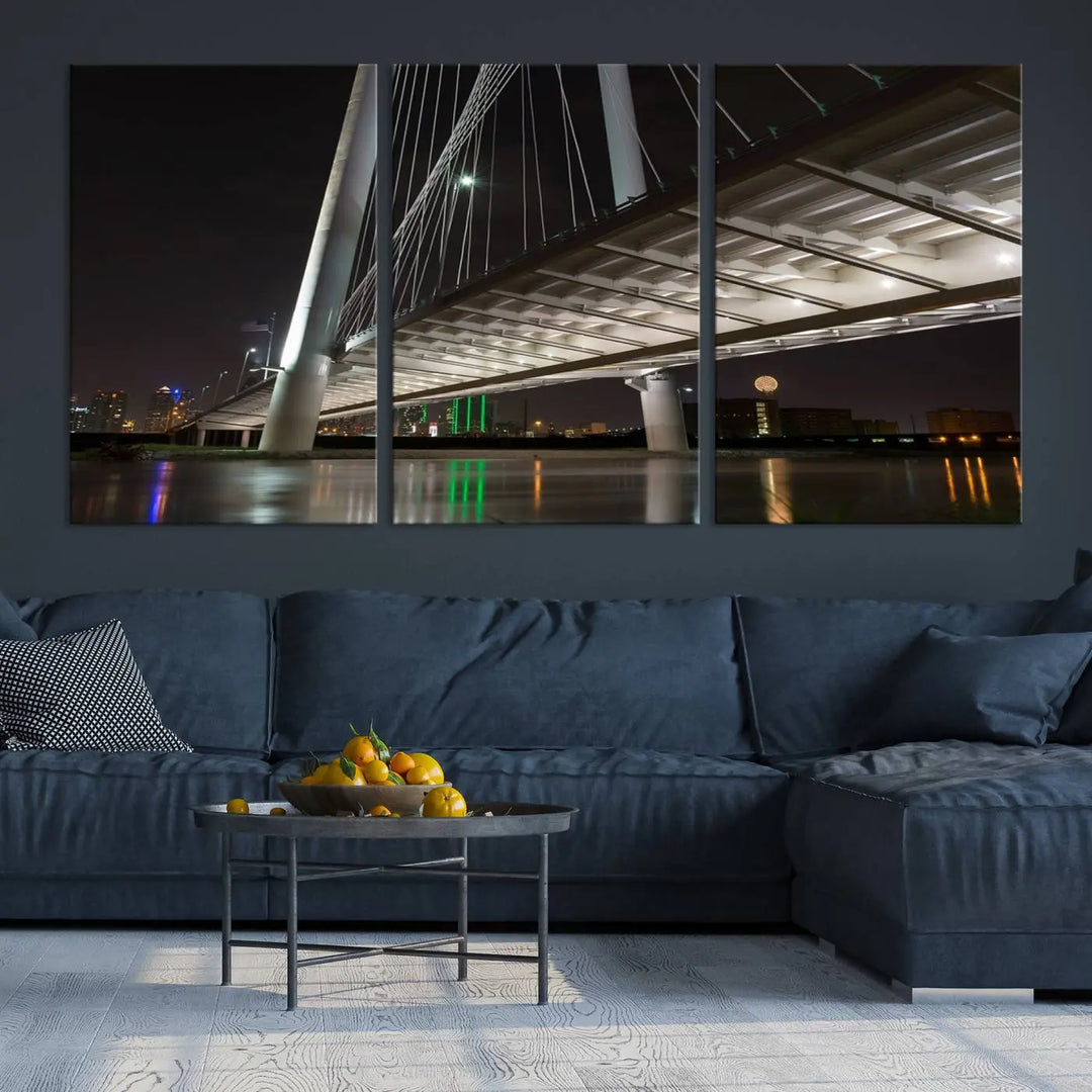 A modern living room showcases the "Dallas City Lights" night skyline cityscape as a triptych on museum-quality canvas. Enjoy the art's longevity with its UV-protective coating, all available with free shipping.