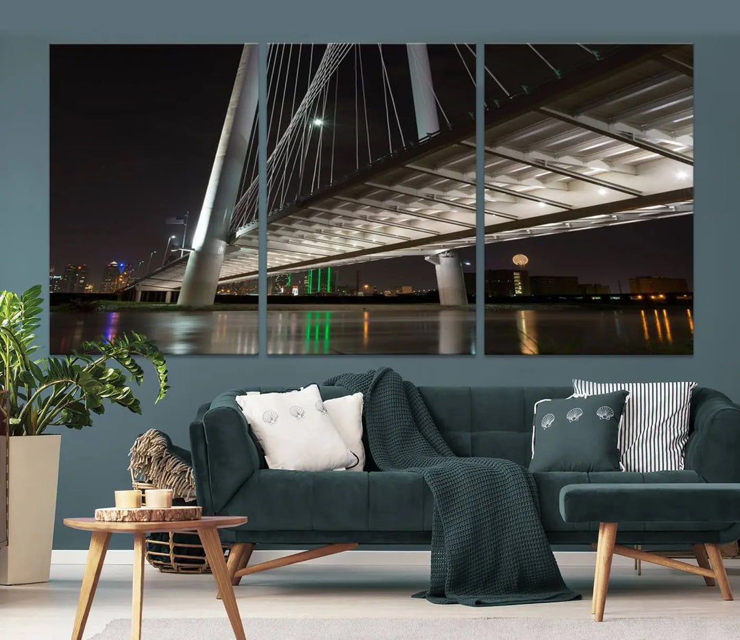 A modern living room showcases the "Dallas City Lights" night skyline cityscape as a triptych on museum-quality canvas. Enjoy the art's longevity with its UV-protective coating, all available with free shipping.