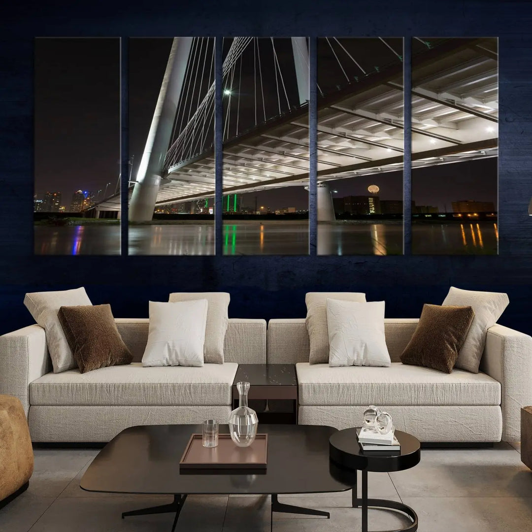 A modern living room showcases the "Dallas City Lights" night skyline cityscape as a triptych on museum-quality canvas. Enjoy the art's longevity with its UV-protective coating, all available with free shipping.