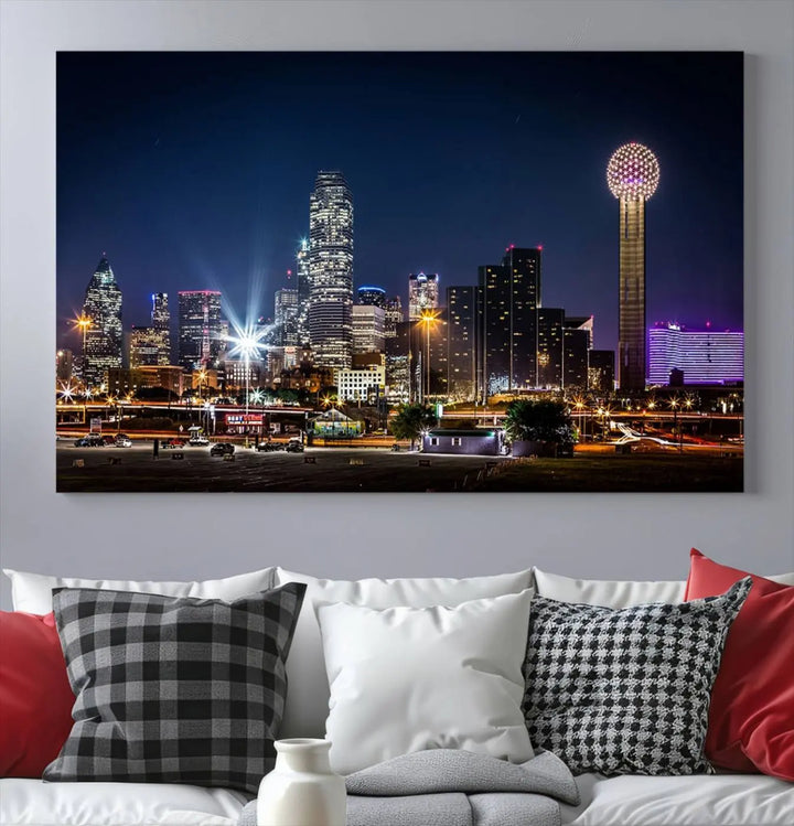 A living room showcases the Dallas City Lights Night Skyline Cityscape View Wall Art Canvas Print, a triptych photo of a city skyline at night on museum-quality canvas that is ready to hang.