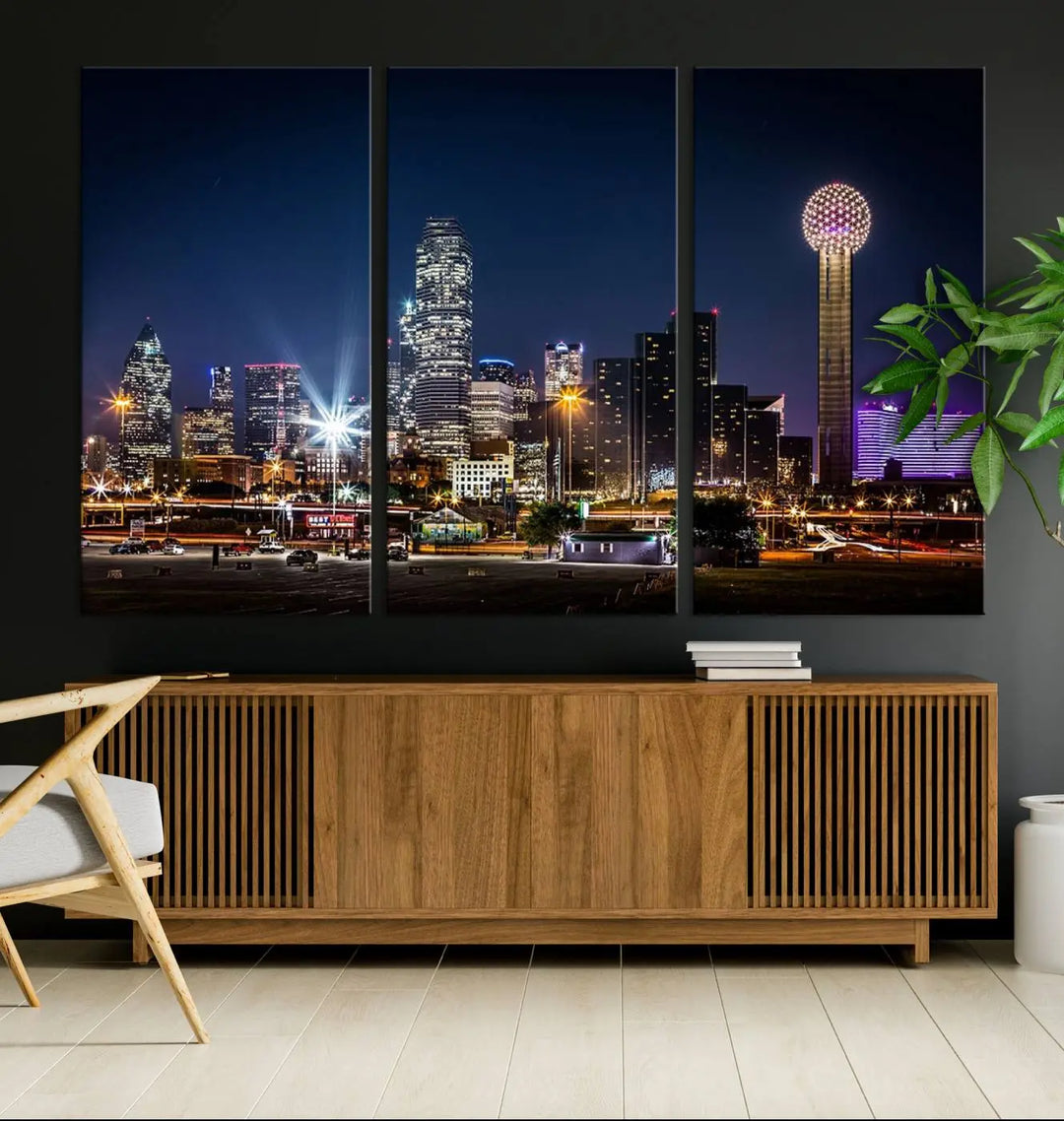 A living room showcases the Dallas City Lights Night Skyline Cityscape View Wall Art Canvas Print, a triptych photo of a city skyline at night on museum-quality canvas that is ready to hang.