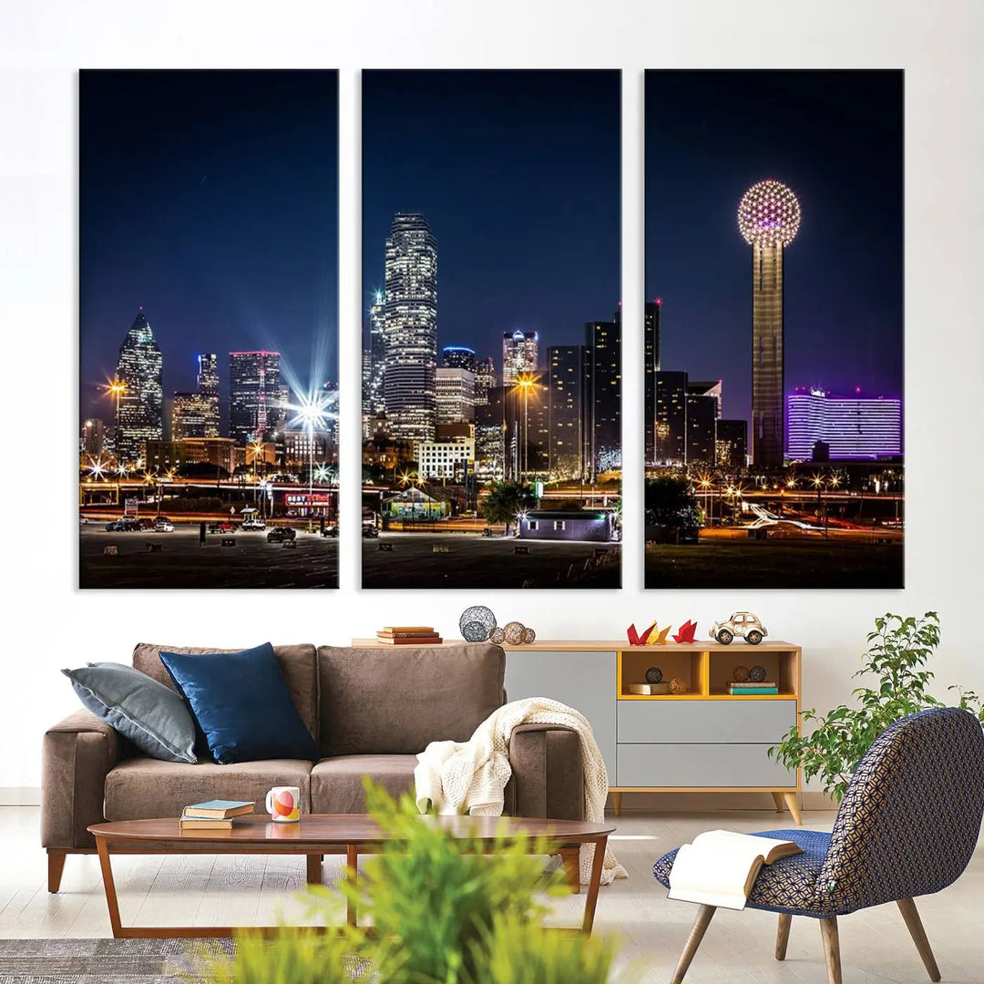 A living room showcases the Dallas City Lights Night Skyline Cityscape View Wall Art Canvas Print, a triptych photo of a city skyline at night on museum-quality canvas that is ready to hang.