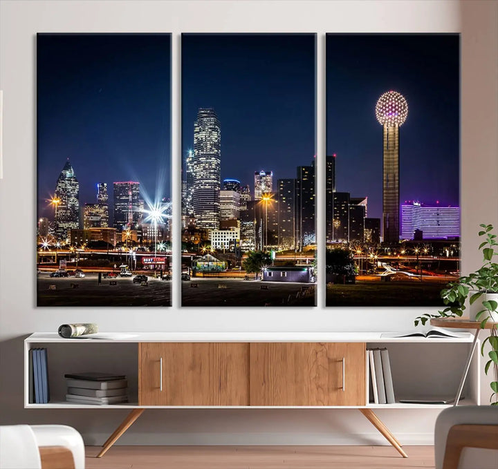 A living room showcases the Dallas City Lights Night Skyline Cityscape View Wall Art Canvas Print, a triptych photo of a city skyline at night on museum-quality canvas that is ready to hang.