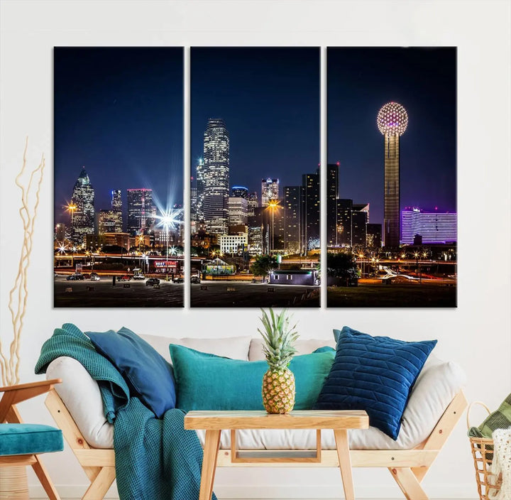 A living room showcases the Dallas City Lights Night Skyline Cityscape View Wall Art Canvas Print, a triptych photo of a city skyline at night on museum-quality canvas that is ready to hang.