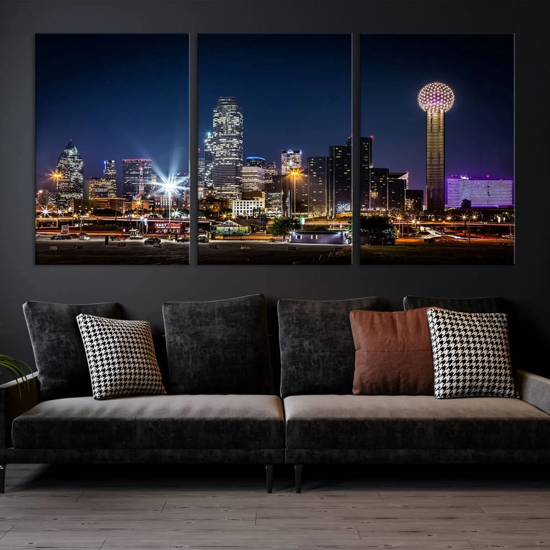 A living room showcases the Dallas City Lights Night Skyline Cityscape View Wall Art Canvas Print, a triptych photo of a city skyline at night on museum-quality canvas that is ready to hang.