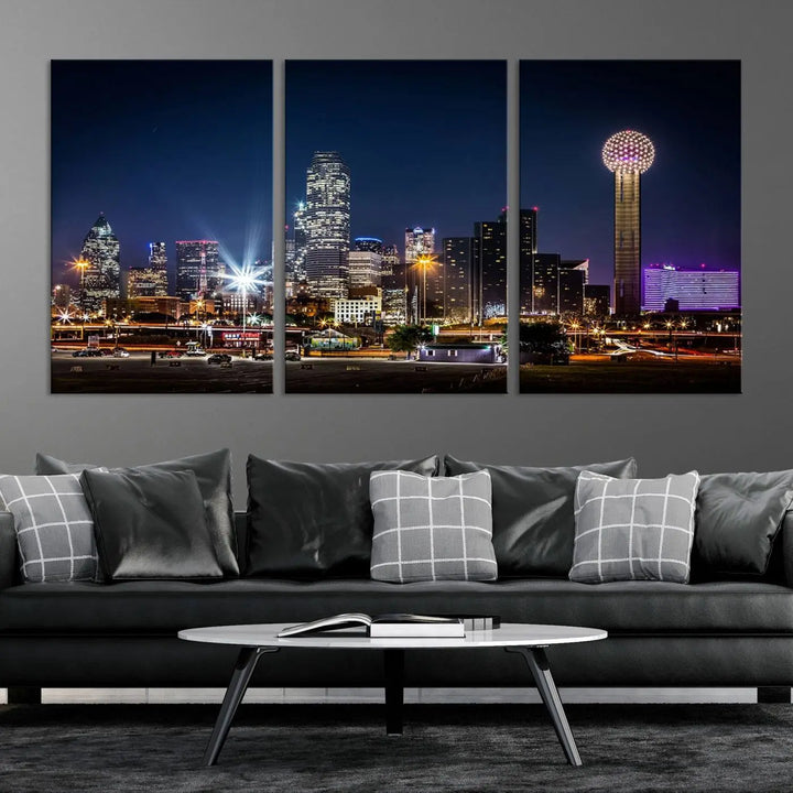 A living room showcases the Dallas City Lights Night Skyline Cityscape View Wall Art Canvas Print, a triptych photo of a city skyline at night on museum-quality canvas that is ready to hang.