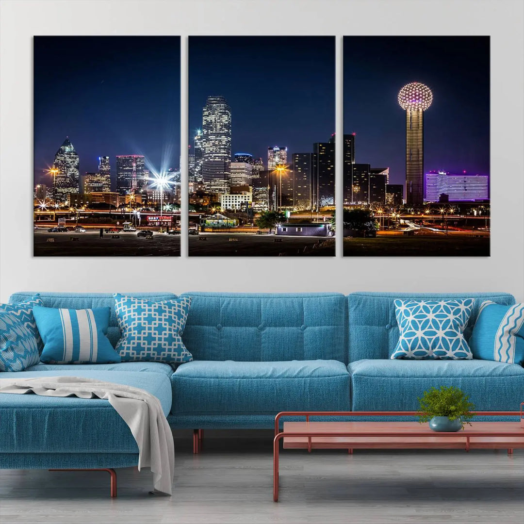 A living room showcases the Dallas City Lights Night Skyline Cityscape View Wall Art Canvas Print, a triptych photo of a city skyline at night on museum-quality canvas that is ready to hang.