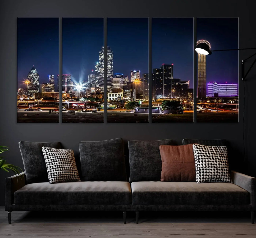 A living room showcases the Dallas City Lights Night Skyline Cityscape View Wall Art Canvas Print, a triptych photo of a city skyline at night on museum-quality canvas that is ready to hang.