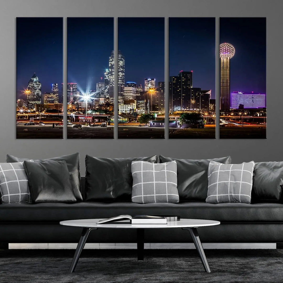 A living room showcases the Dallas City Lights Night Skyline Cityscape View Wall Art Canvas Print, a triptych photo of a city skyline at night on museum-quality canvas that is ready to hang.