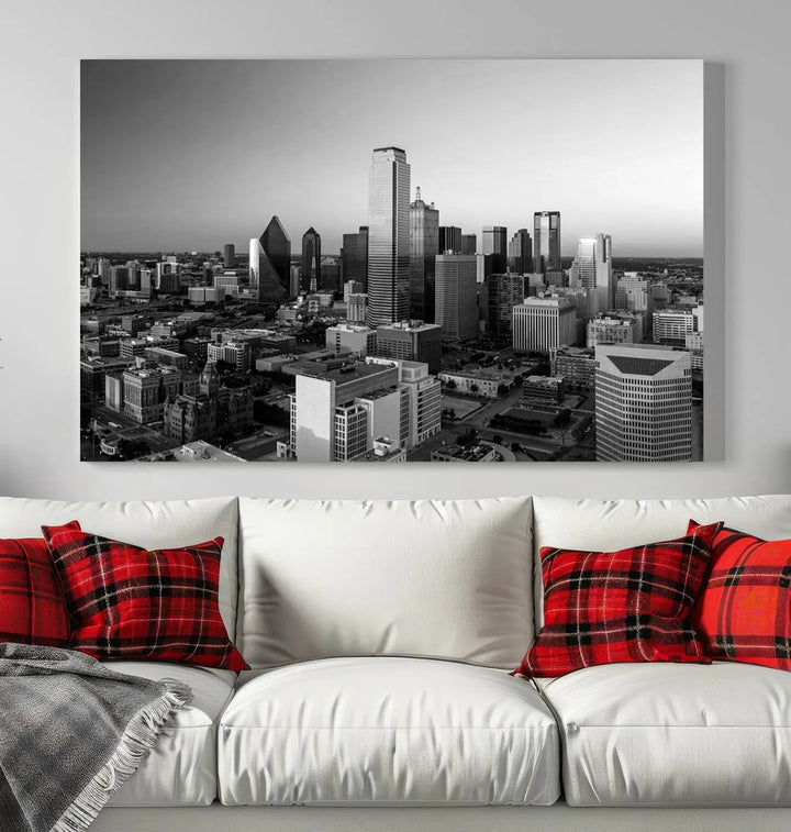 A modern living room showcases the Dallas City Lights Skyline Black and White Wall Art Cityscape Canvas Print. This gallery-wrapped piece offers a sleek finish and is crafted from museum-quality pollycotton. It features a UV-protective coating to ensure lasting vibrancy.