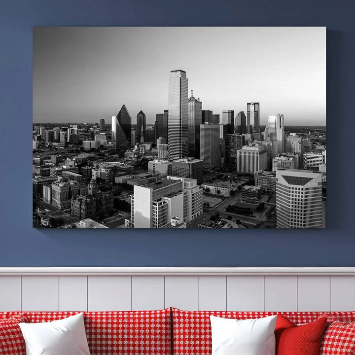 A modern living room showcases the Dallas City Lights Skyline Black and White Wall Art Cityscape Canvas Print. This gallery-wrapped piece offers a sleek finish and is crafted from museum-quality pollycotton. It features a UV-protective coating to ensure lasting vibrancy.