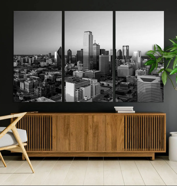 A modern living room showcases the Dallas City Lights Skyline Black and White Wall Art Cityscape Canvas Print. This gallery-wrapped piece offers a sleek finish and is crafted from museum-quality pollycotton. It features a UV-protective coating to ensure lasting vibrancy.