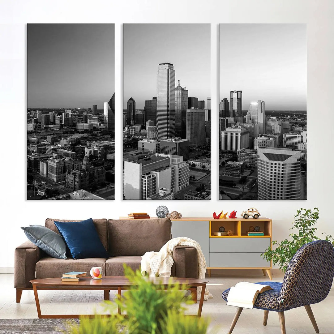 A modern living room showcases the Dallas City Lights Skyline Black and White Wall Art Cityscape Canvas Print. This gallery-wrapped piece offers a sleek finish and is crafted from museum-quality pollycotton. It features a UV-protective coating to ensure lasting vibrancy.