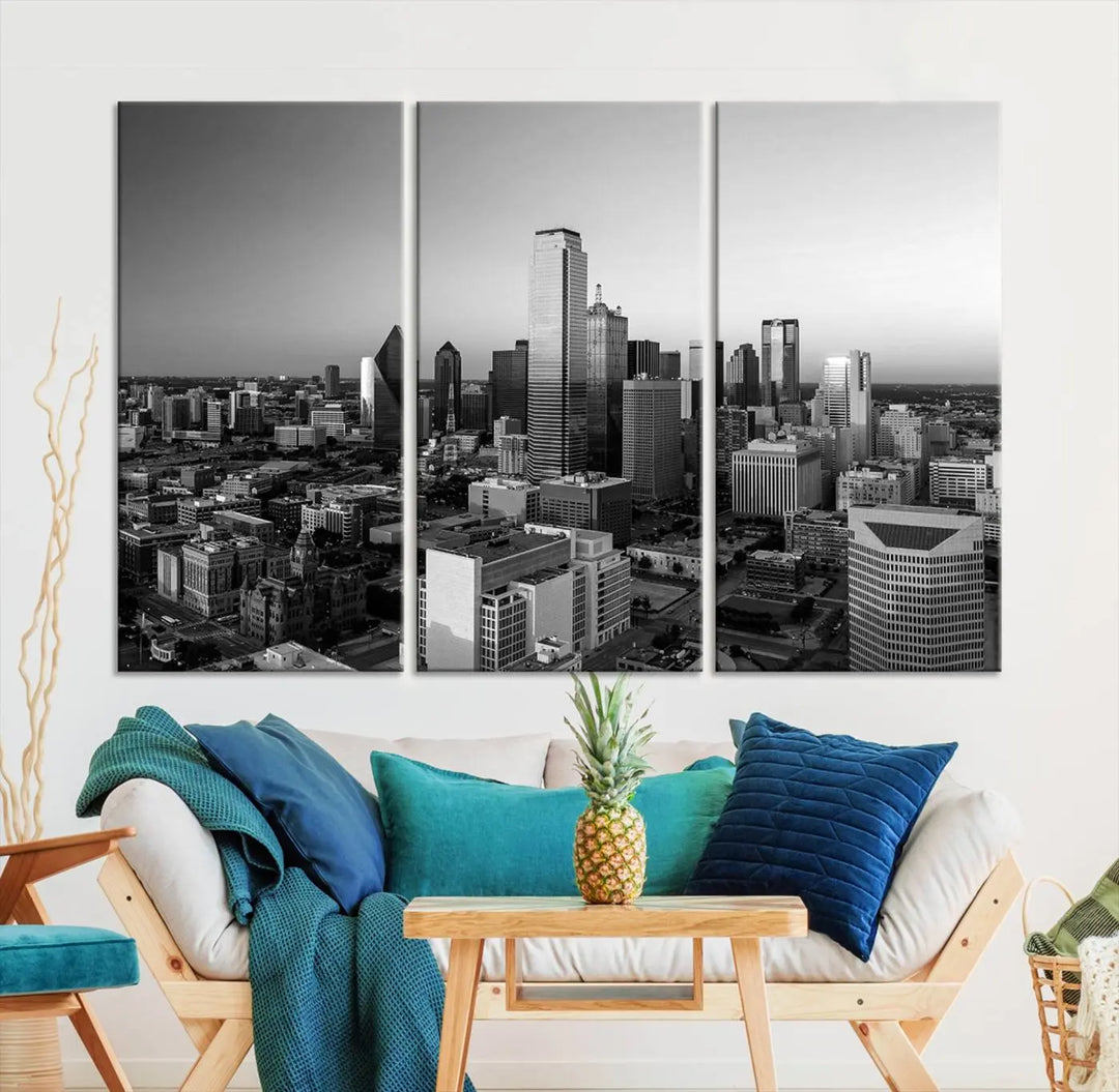 A modern living room showcases the Dallas City Lights Skyline Black and White Wall Art Cityscape Canvas Print. This gallery-wrapped piece offers a sleek finish and is crafted from museum-quality pollycotton. It features a UV-protective coating to ensure lasting vibrancy.