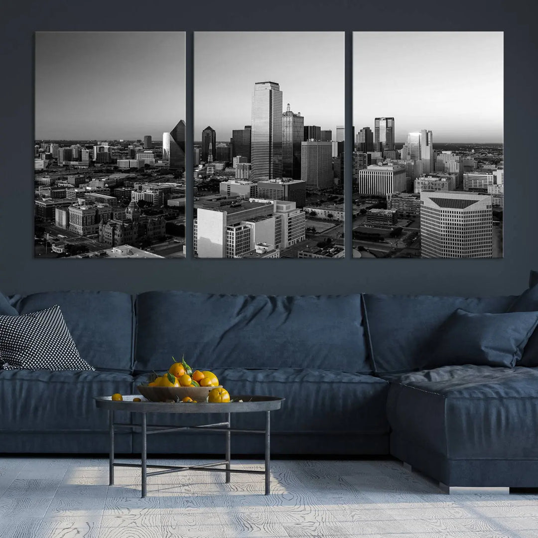 A modern living room showcases the Dallas City Lights Skyline Black and White Wall Art Cityscape Canvas Print. This gallery-wrapped piece offers a sleek finish and is crafted from museum-quality pollycotton. It features a UV-protective coating to ensure lasting vibrancy.