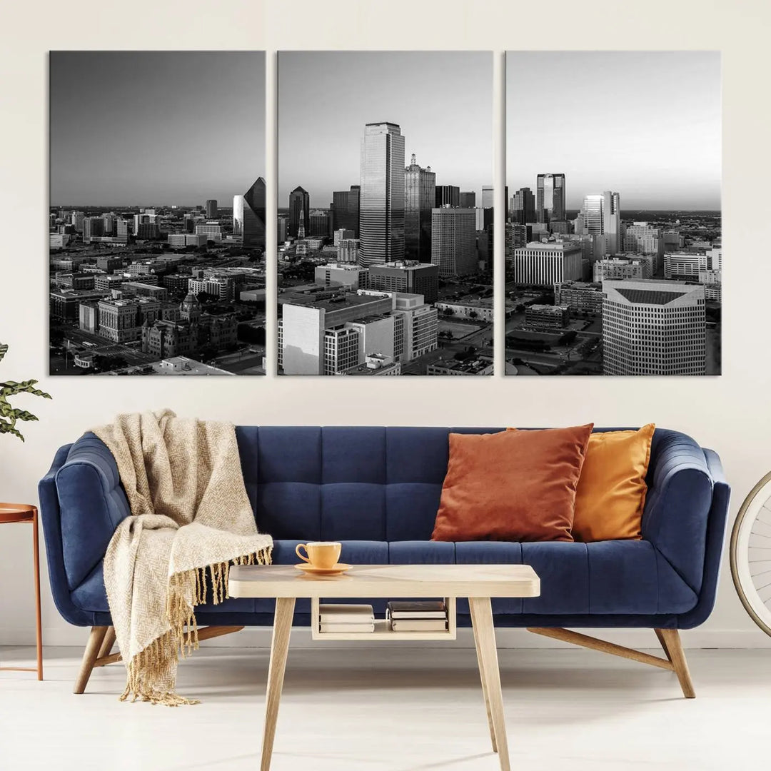 A modern living room showcases the Dallas City Lights Skyline Black and White Wall Art Cityscape Canvas Print. This gallery-wrapped piece offers a sleek finish and is crafted from museum-quality pollycotton. It features a UV-protective coating to ensure lasting vibrancy.