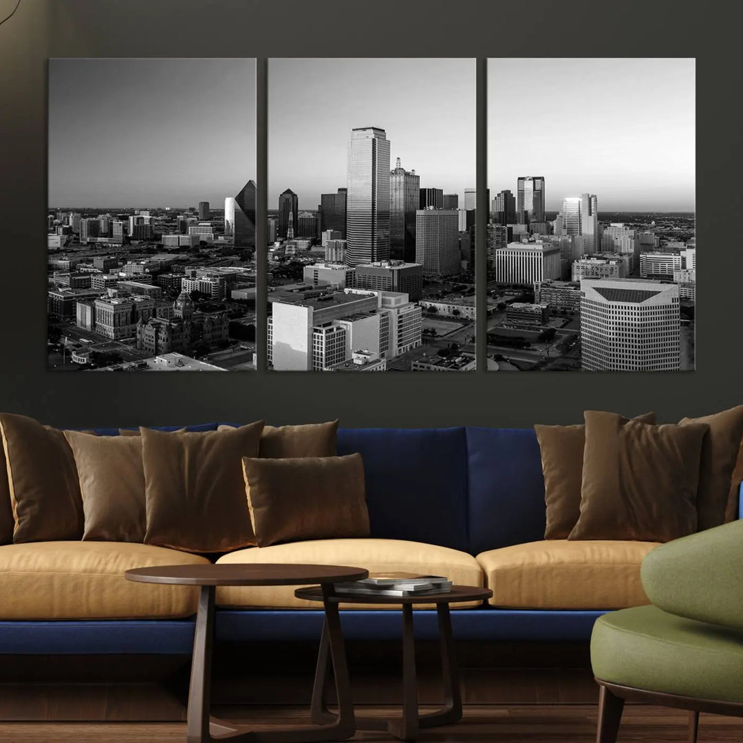 A modern living room showcases the Dallas City Lights Skyline Black and White Wall Art Cityscape Canvas Print. This gallery-wrapped piece offers a sleek finish and is crafted from museum-quality pollycotton. It features a UV-protective coating to ensure lasting vibrancy.