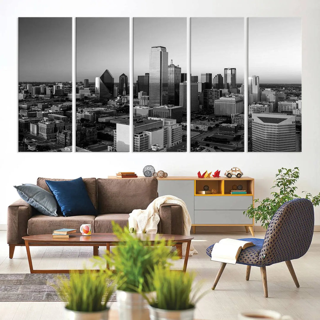 A modern living room showcases the Dallas City Lights Skyline Black and White Wall Art Cityscape Canvas Print. This gallery-wrapped piece offers a sleek finish and is crafted from museum-quality pollycotton. It features a UV-protective coating to ensure lasting vibrancy.