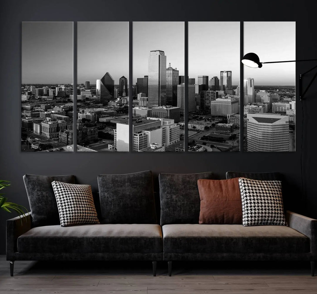 A modern living room showcases the Dallas City Lights Skyline Black and White Wall Art Cityscape Canvas Print. This gallery-wrapped piece offers a sleek finish and is crafted from museum-quality pollycotton. It features a UV-protective coating to ensure lasting vibrancy.