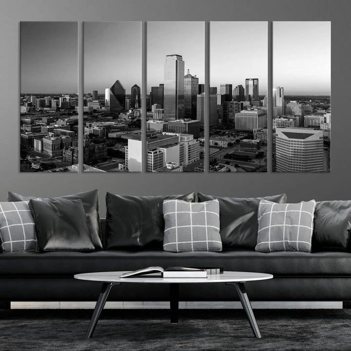 A modern living room showcases the Dallas City Lights Skyline Black and White Wall Art Cityscape Canvas Print. This gallery-wrapped piece offers a sleek finish and is crafted from museum-quality pollycotton. It features a UV-protective coating to ensure lasting vibrancy.