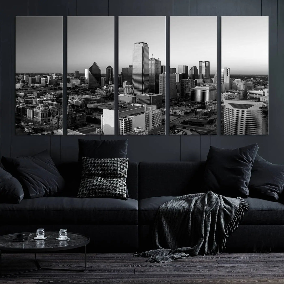 A modern living room showcases the Dallas City Lights Skyline Black and White Wall Art Cityscape Canvas Print. This gallery-wrapped piece offers a sleek finish and is crafted from museum-quality pollycotton. It features a UV-protective coating to ensure lasting vibrancy.