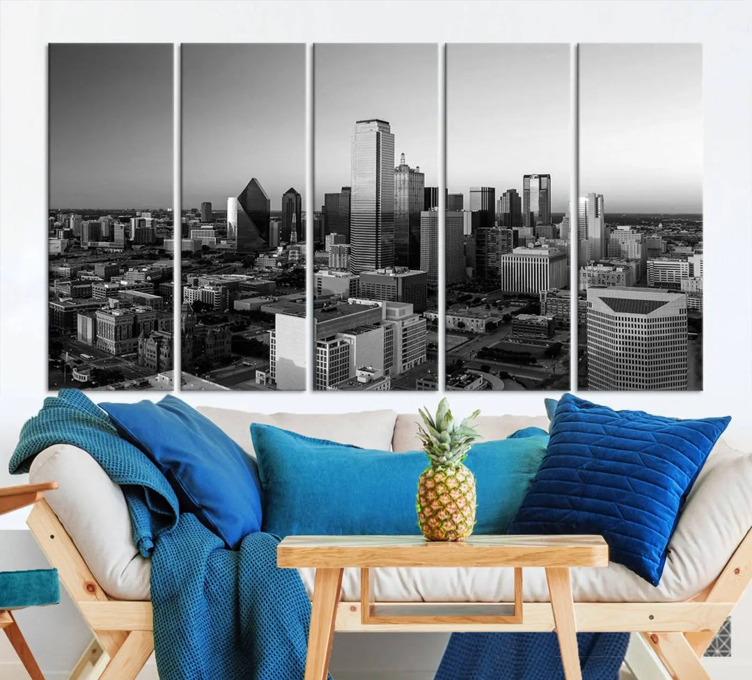 A modern living room showcases the Dallas City Lights Skyline Black and White Wall Art Cityscape Canvas Print. This gallery-wrapped piece offers a sleek finish and is crafted from museum-quality pollycotton. It features a UV-protective coating to ensure lasting vibrancy.