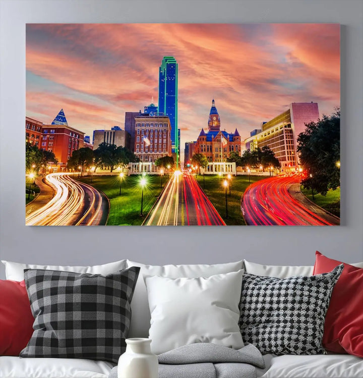 The "Dallas City Lights Sunset Orange Cloudy Skyline Cityscape View" wall art, exquisitely printed on museum-quality canvas and featuring a UV-protective coating, hangs on a dark wall.