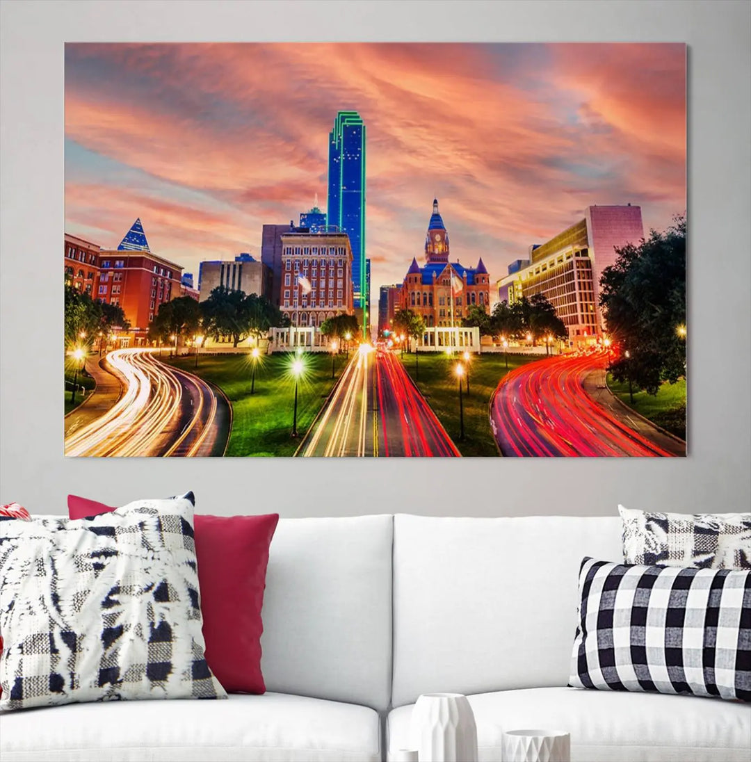 The "Dallas City Lights Sunset Orange Cloudy Skyline Cityscape View" wall art, exquisitely printed on museum-quality canvas and featuring a UV-protective coating, hangs on a dark wall.