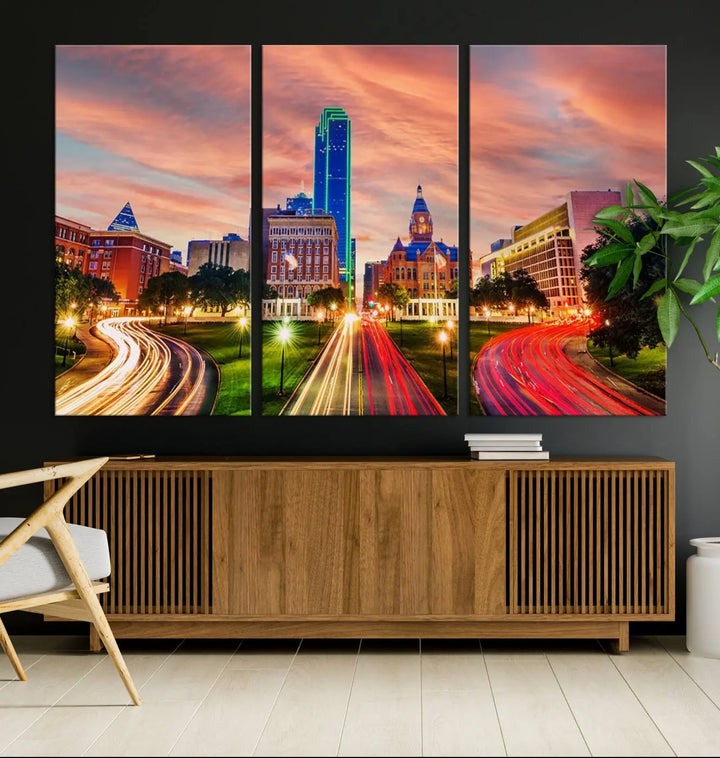 The "Dallas City Lights Sunset Orange Cloudy Skyline Cityscape View" wall art, exquisitely printed on museum-quality canvas and featuring a UV-protective coating, hangs on a dark wall.