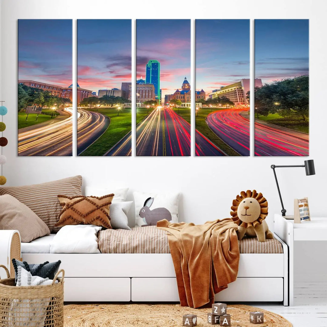 A modern living room features a cityscape triptych wall art titled "Dallas City Street Lights Sunset Pink Cloudy Skyline Cityscape View," printed on museum-quality canvas. It captures a vibrant evening skyline with light trails.