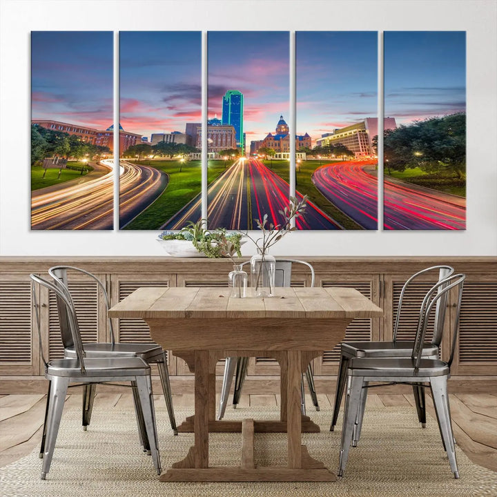 A modern living room features a cityscape triptych wall art titled "Dallas City Street Lights Sunset Pink Cloudy Skyline Cityscape View," printed on museum-quality canvas. It captures a vibrant evening skyline with light trails.