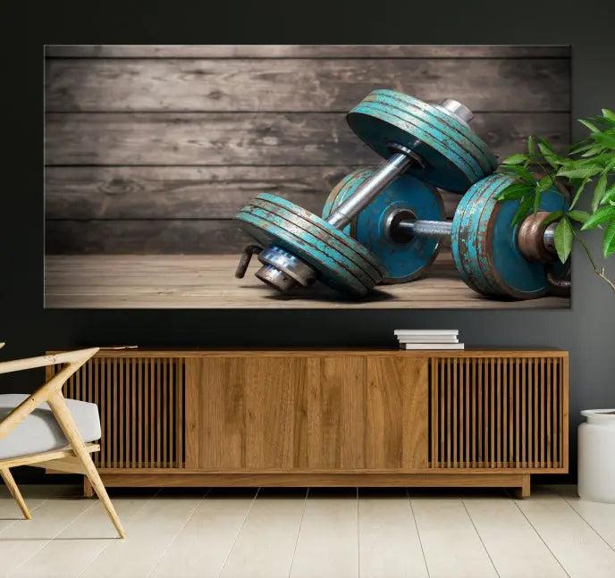 Adorn your walls with the Dambell and Sport Wall Art Canvas Print, showcasing teal dumbbells against rustic wooden panels for a touch of museum-quality elegance.