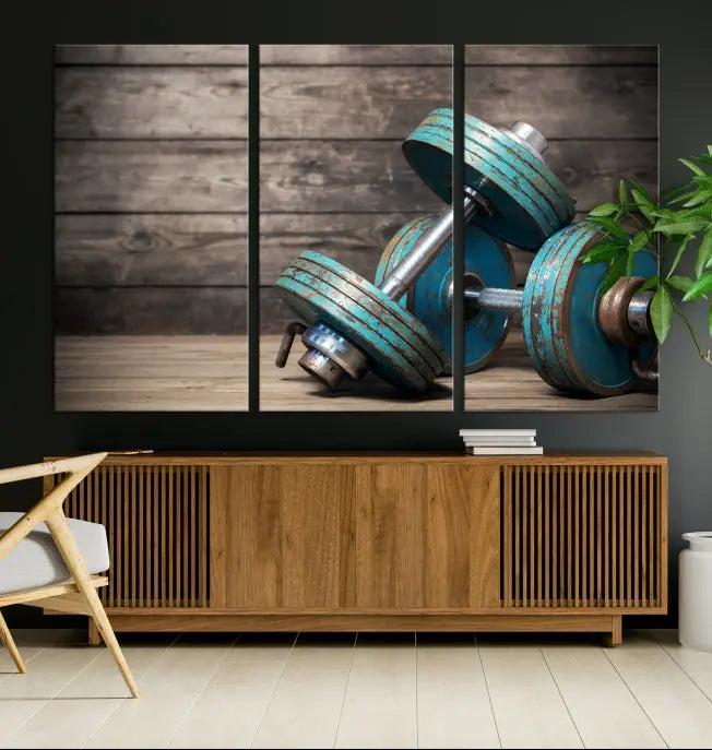 Adorn your walls with the Dambell and Sport Wall Art Canvas Print, showcasing teal dumbbells against rustic wooden panels for a touch of museum-quality elegance.