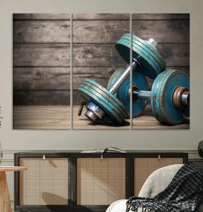 Adorn your walls with the Dambell and Sport Wall Art Canvas Print, showcasing teal dumbbells against rustic wooden panels for a touch of museum-quality elegance.