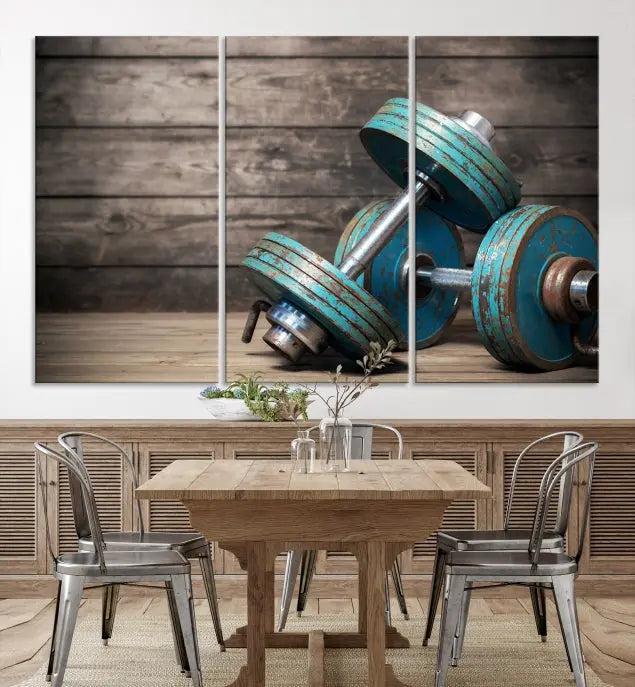 Adorn your walls with the Dambell and Sport Wall Art Canvas Print, showcasing teal dumbbells against rustic wooden panels for a touch of museum-quality elegance.