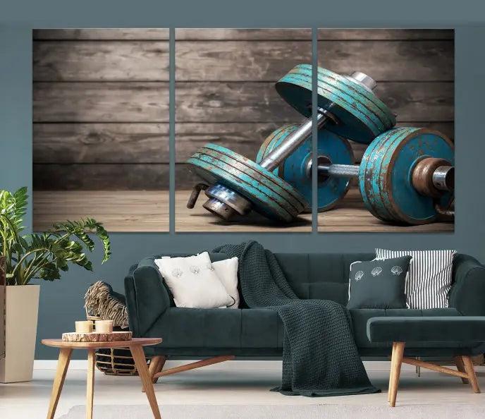 Adorn your walls with the Dambell and Sport Wall Art Canvas Print, showcasing teal dumbbells against rustic wooden panels for a touch of museum-quality elegance.