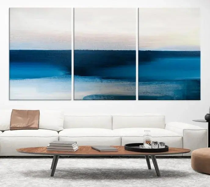 The living room is enhanced by the Dark Blue Abstract Wall Art Canvas Print, a triptych painting on hand-assembled framed canvas with UV-protective coating for enduring vibrancy.