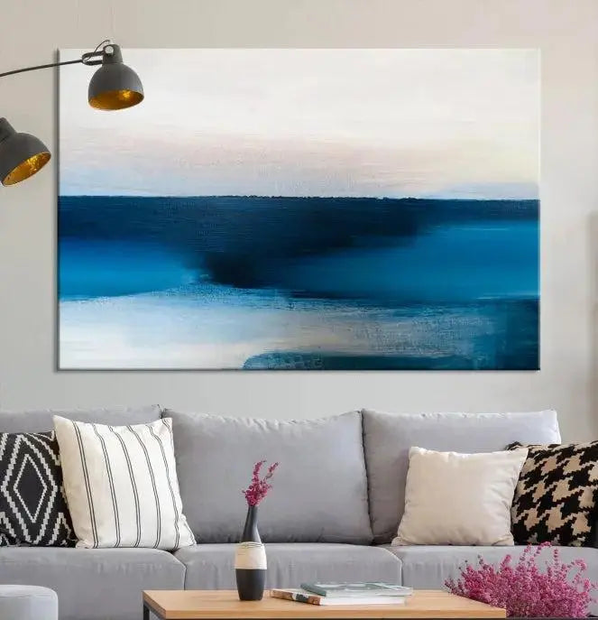 The living room is enhanced by the Dark Blue Abstract Wall Art Canvas Print, a triptych painting on hand-assembled framed canvas with UV-protective coating for enduring vibrancy.