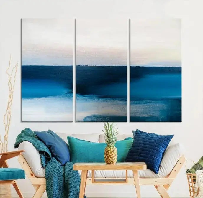 The living room is enhanced by the Dark Blue Abstract Wall Art Canvas Print, a triptych painting on hand-assembled framed canvas with UV-protective coating for enduring vibrancy.