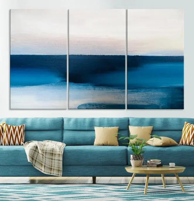 The living room is enhanced by the Dark Blue Abstract Wall Art Canvas Print, a triptych painting on hand-assembled framed canvas with UV-protective coating for enduring vibrancy.