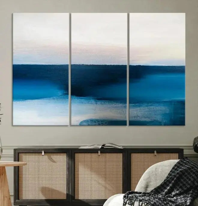 The living room is enhanced by the Dark Blue Abstract Wall Art Canvas Print, a triptych painting on hand-assembled framed canvas with UV-protective coating for enduring vibrancy.