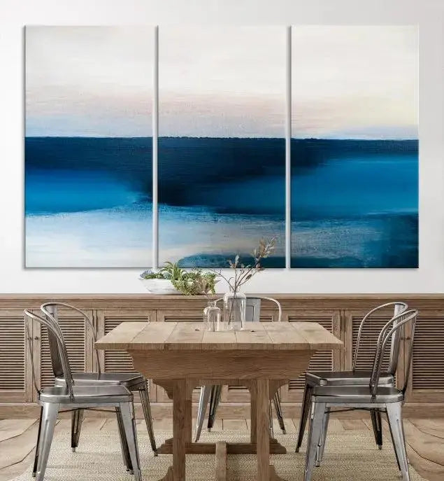 The living room is enhanced by the Dark Blue Abstract Wall Art Canvas Print, a triptych painting on hand-assembled framed canvas with UV-protective coating for enduring vibrancy.