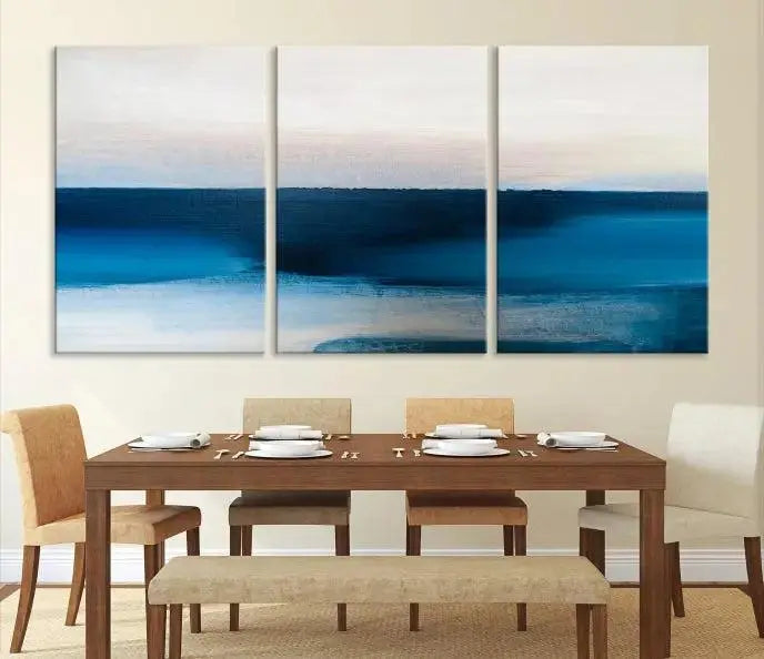 The living room is enhanced by the Dark Blue Abstract Wall Art Canvas Print, a triptych painting on hand-assembled framed canvas with UV-protective coating for enduring vibrancy.