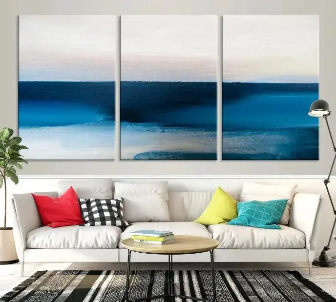 The living room is enhanced by the Dark Blue Abstract Wall Art Canvas Print, a triptych painting on hand-assembled framed canvas with UV-protective coating for enduring vibrancy.