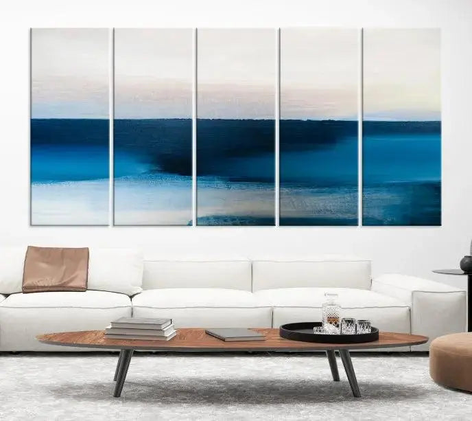 The living room is enhanced by the Dark Blue Abstract Wall Art Canvas Print, a triptych painting on hand-assembled framed canvas with UV-protective coating for enduring vibrancy.